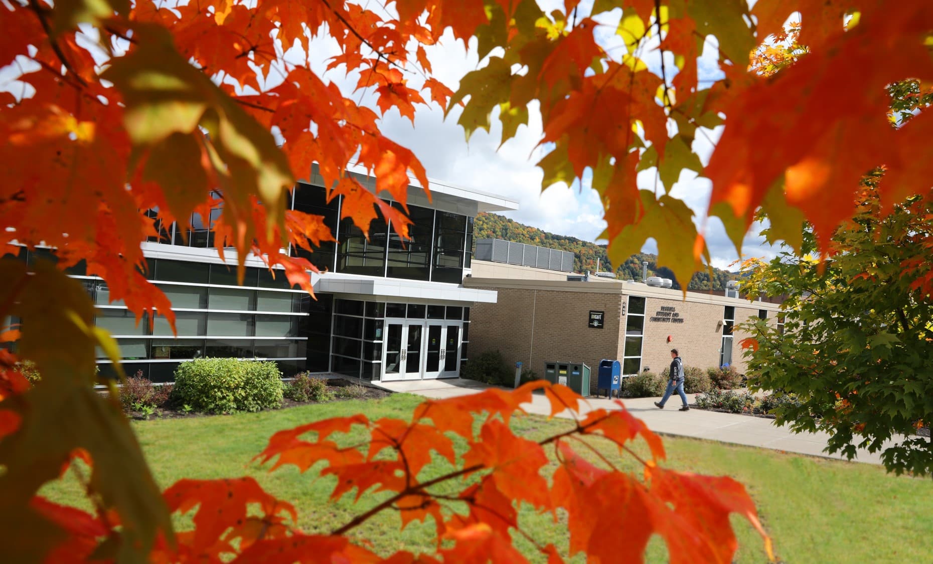 Farrell Hall behind autumn leaves